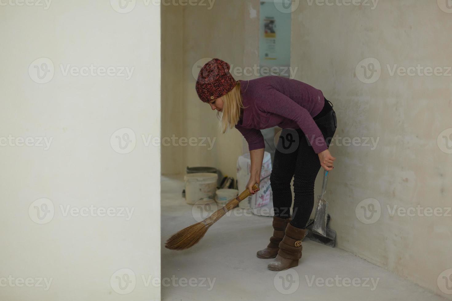 Broom and powder scoop style thai girl sweeping repairs photo