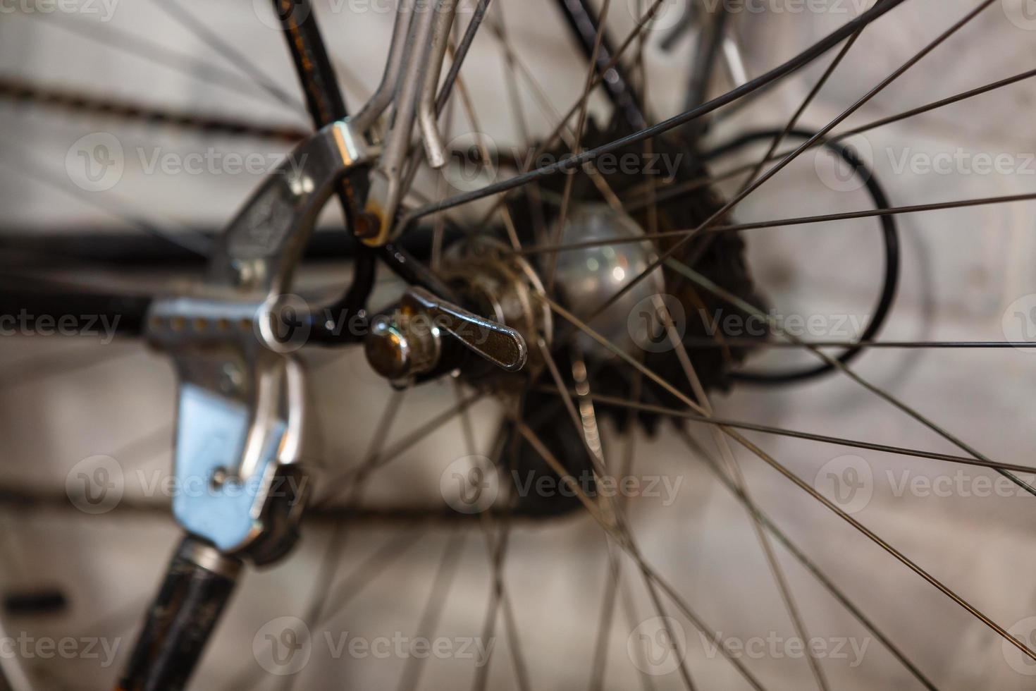 A bicycle chain is a roller chain that transfers power from the pedals to the drive wheel photo