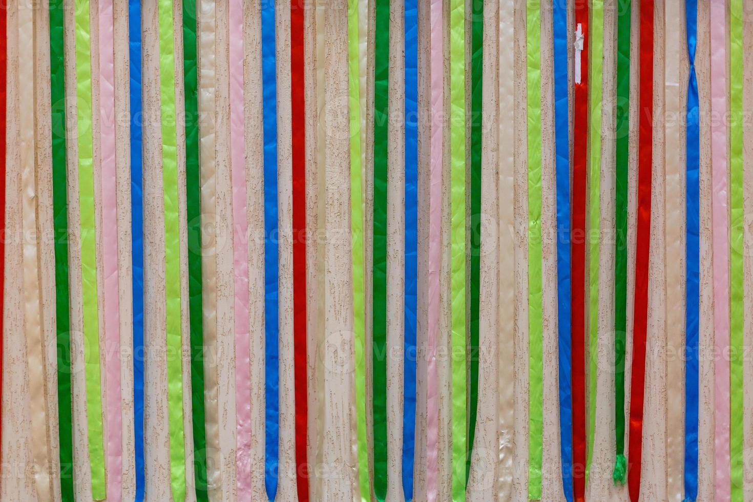 Colorful fabric ribbons play of red blue pink and other colors abstract pattern or texture photo