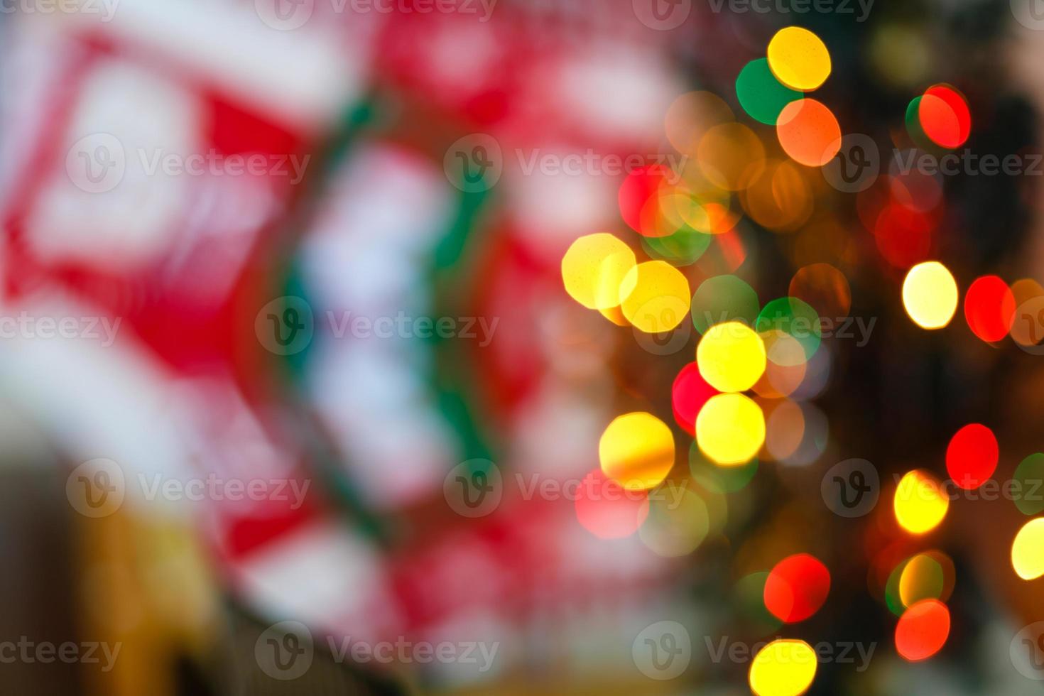 Christmas decoration of fireplace and fir tree in living room festive and blurred lights design photo