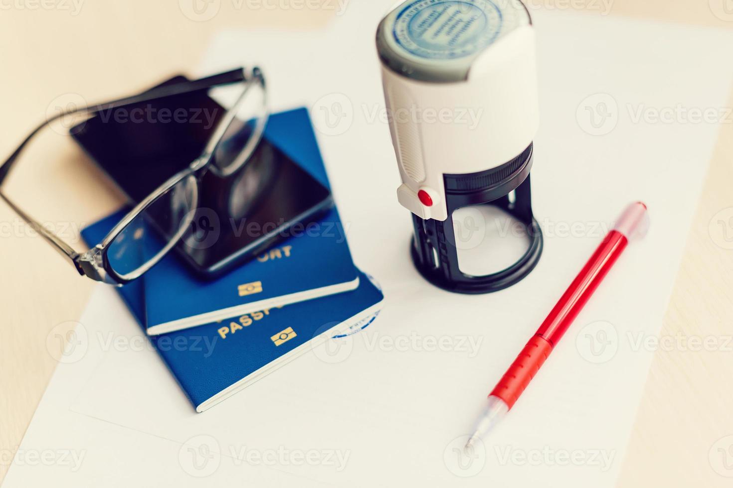 Visa and passport with denied stamp on a document top view in immigration. travel immigration stamp and tourism concept photo