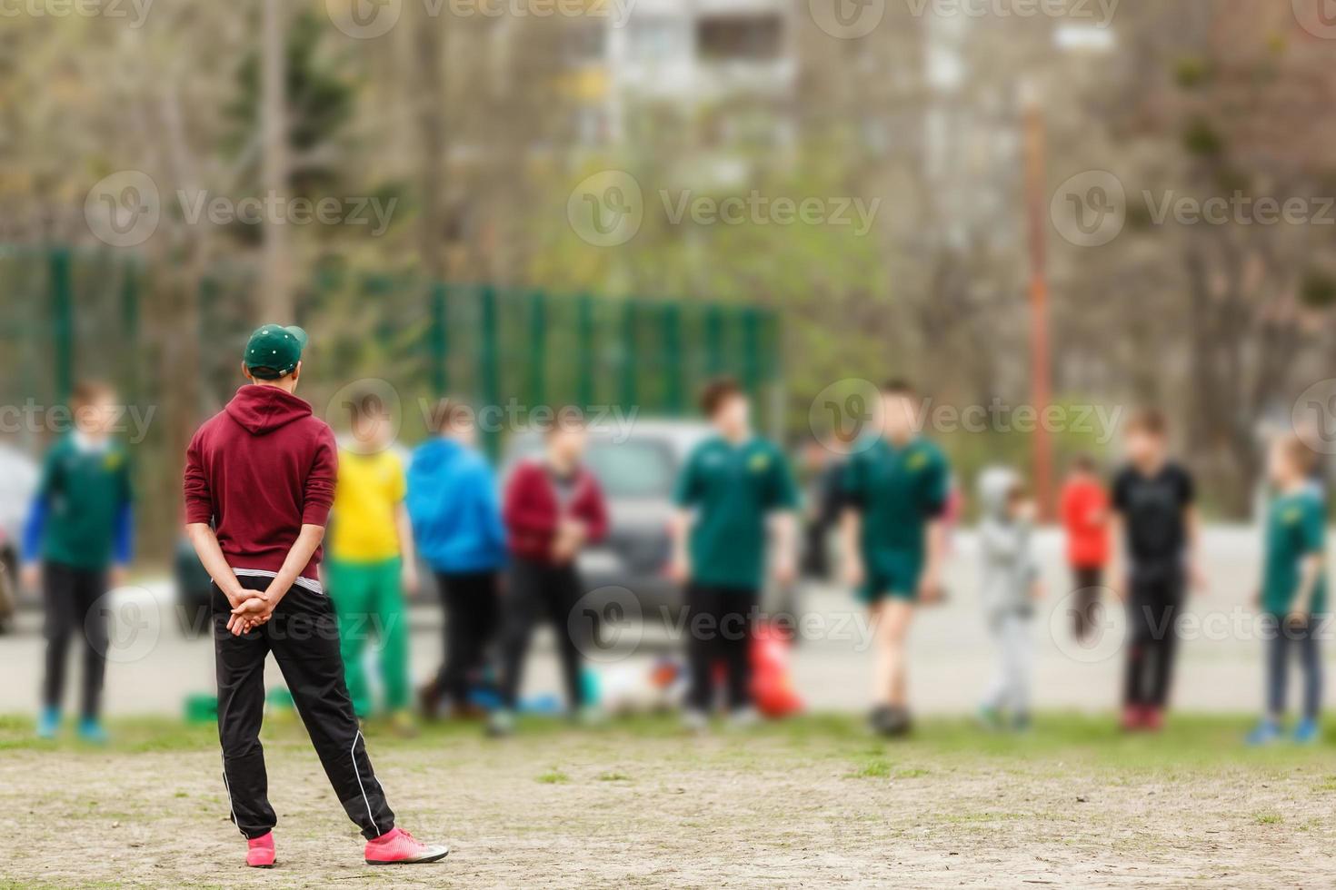 Coach stands in front of his students and gives instructions before training. photo