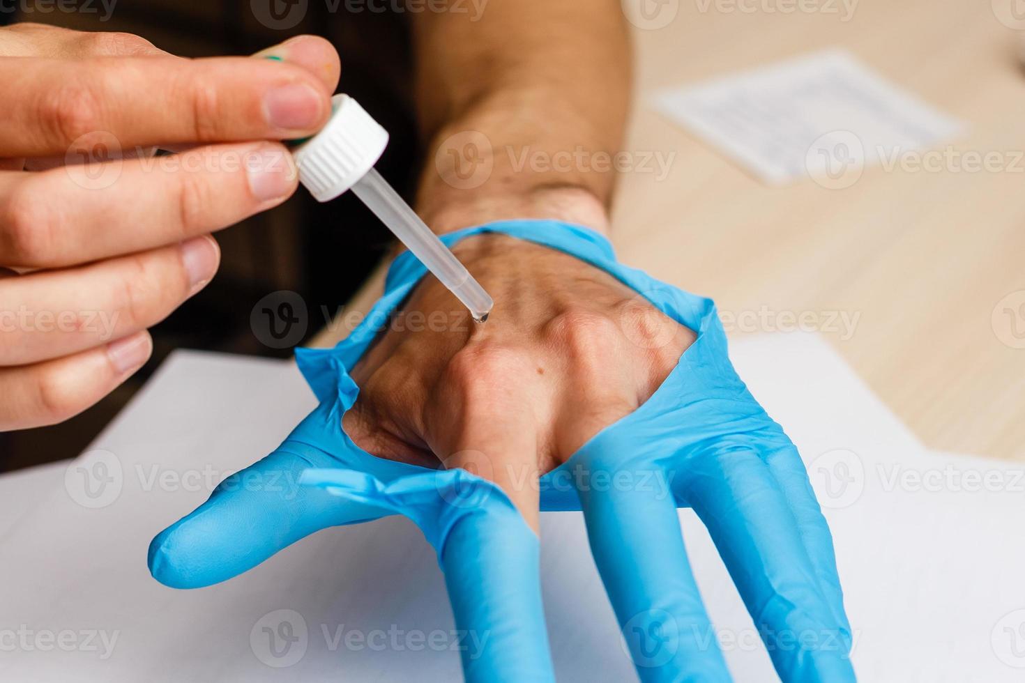 Scientist using pipette in laboratory selective focus photo