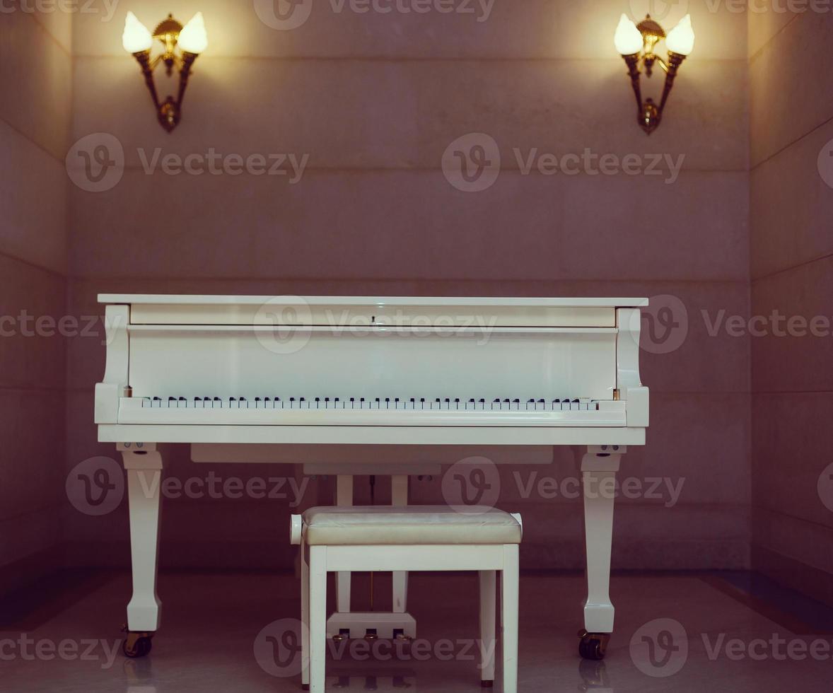 White piano in a room photo