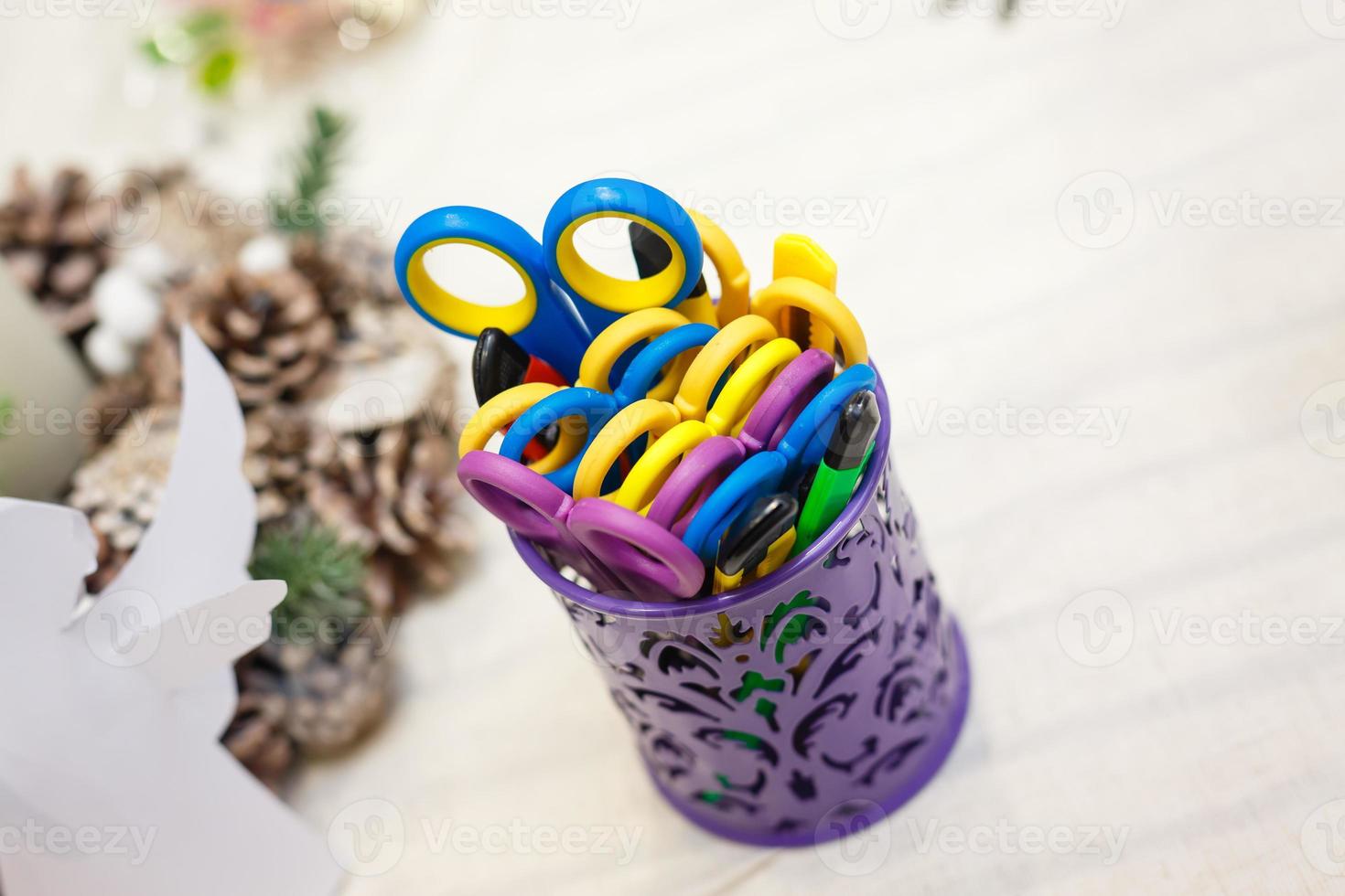 School supplies in a shopping basket on white background photo