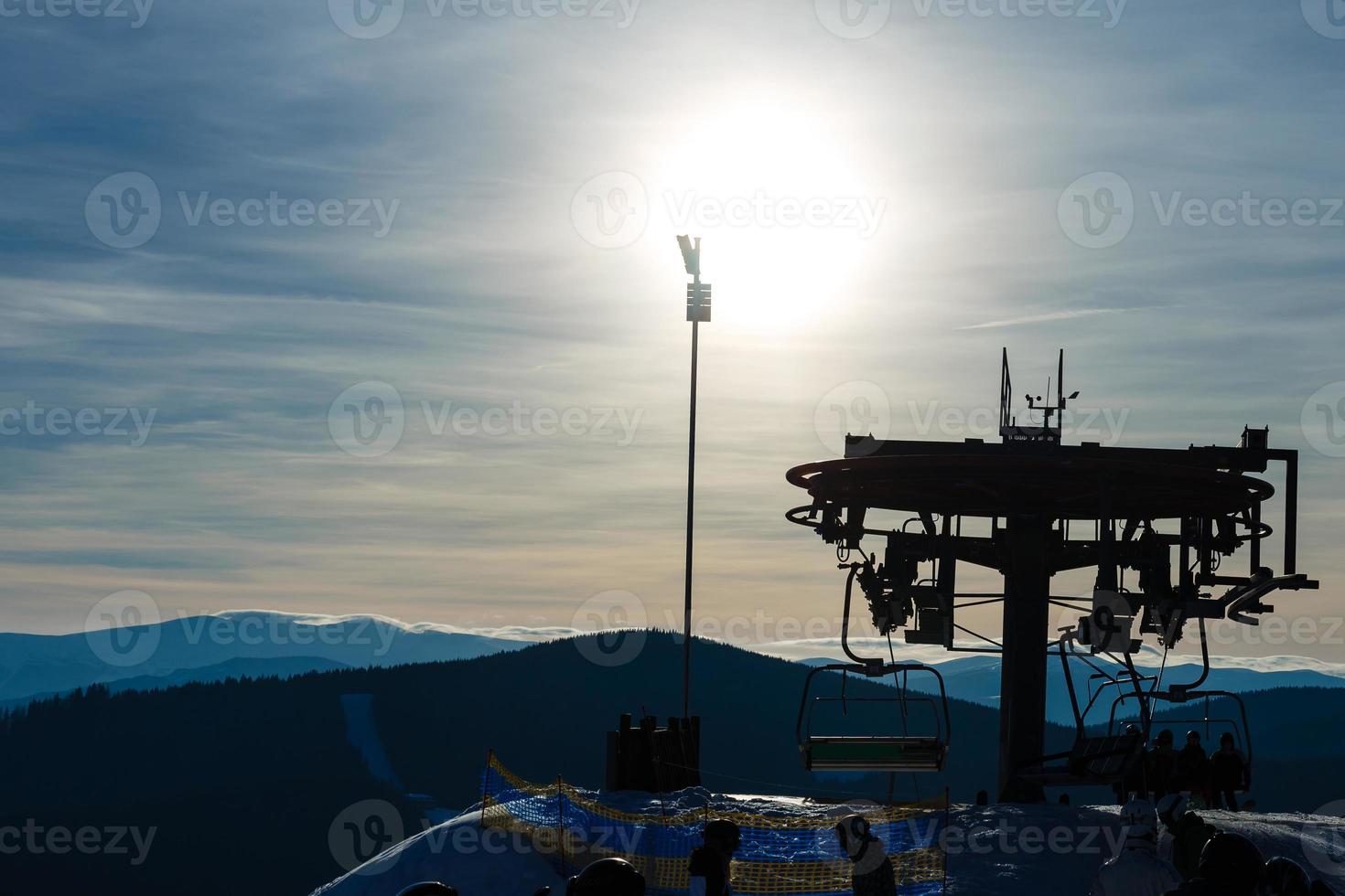 Winter mountains panorama with ski slopes and ski lifts photo