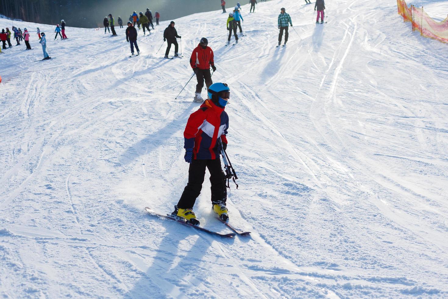 BUKOVEL, UKRAINE - January 27, 2018 tourists of skiers and snowboarders, the largest ski resort in Eastern Europe photo