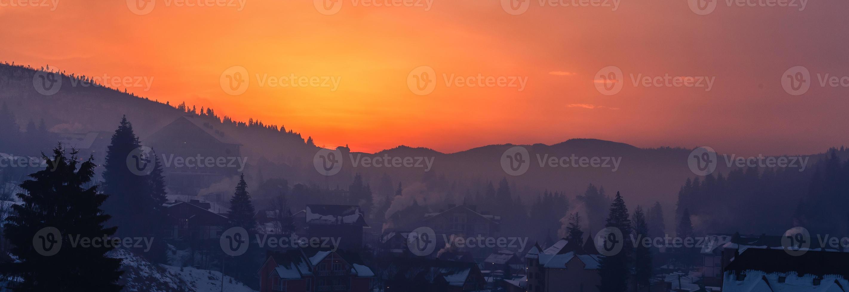 Colorful autumn morning in the Carpathians. Dramatic sunrise in the mountain village. Artistic style post processed photo. photo