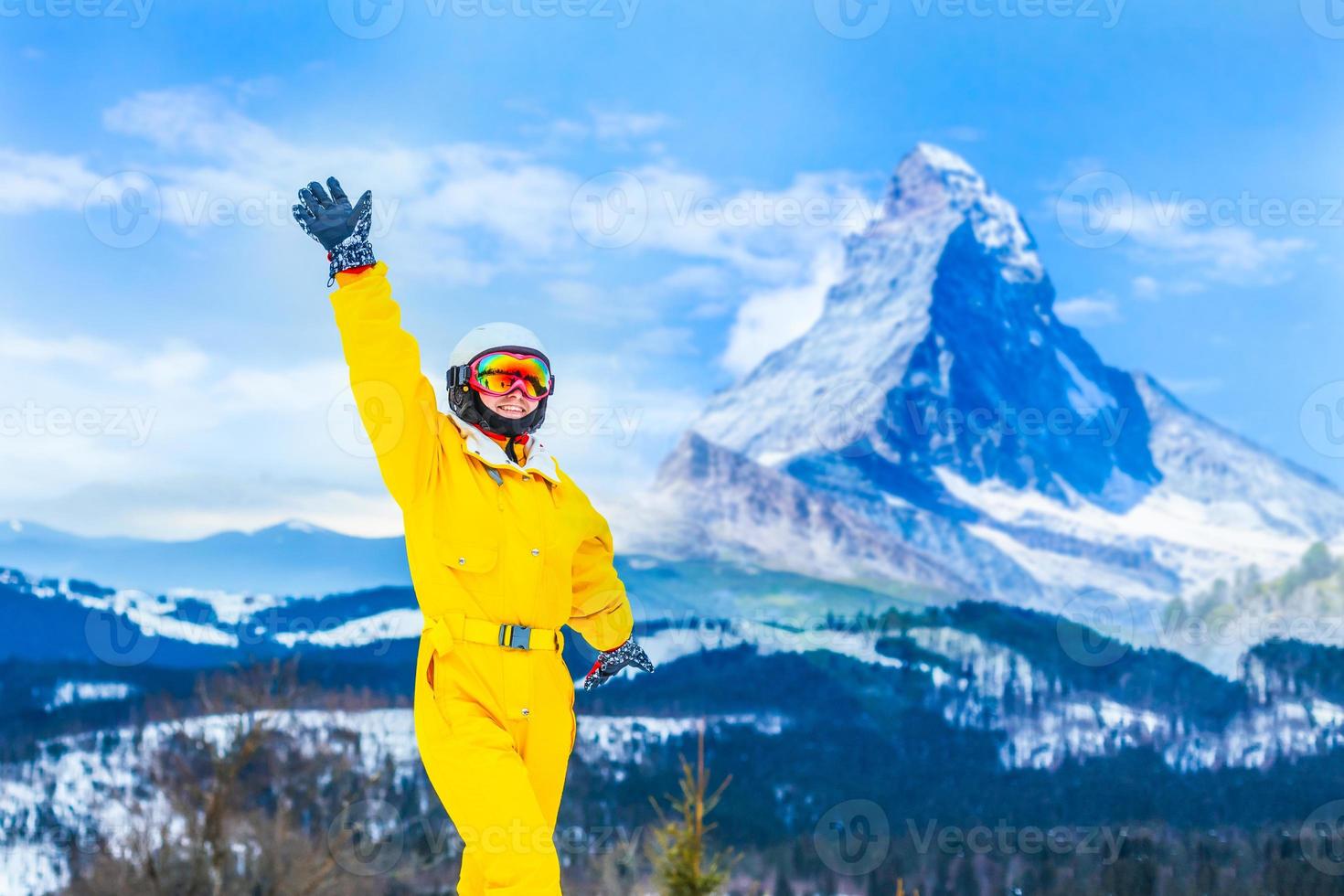 Female skier on the top of ski slope photo