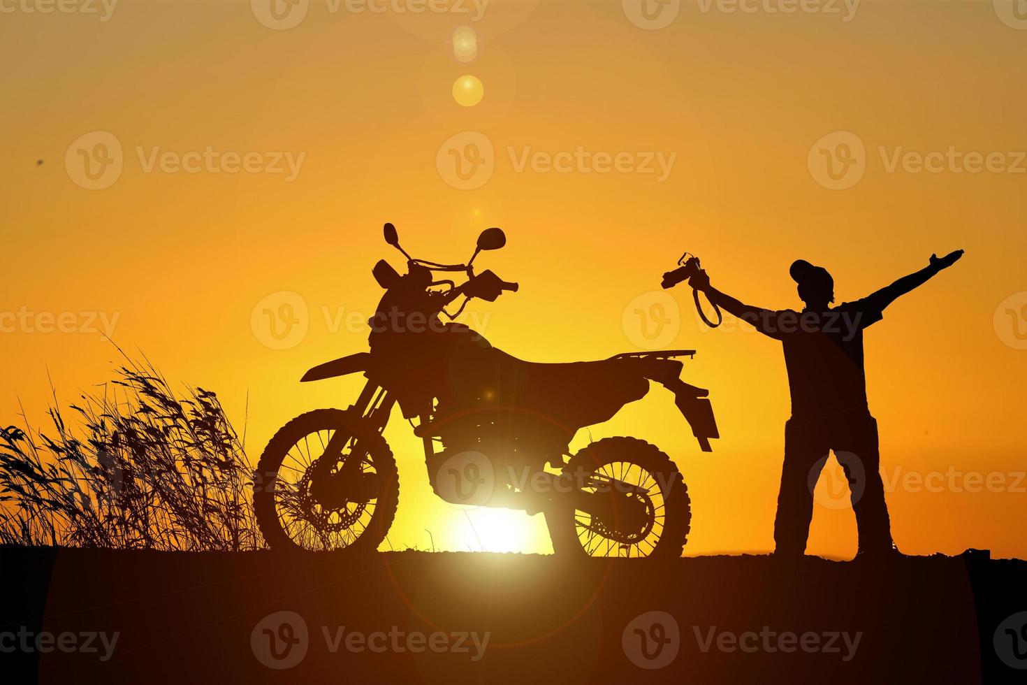 Man traveling freely with a motocross bike. motorcycle travel concept photo