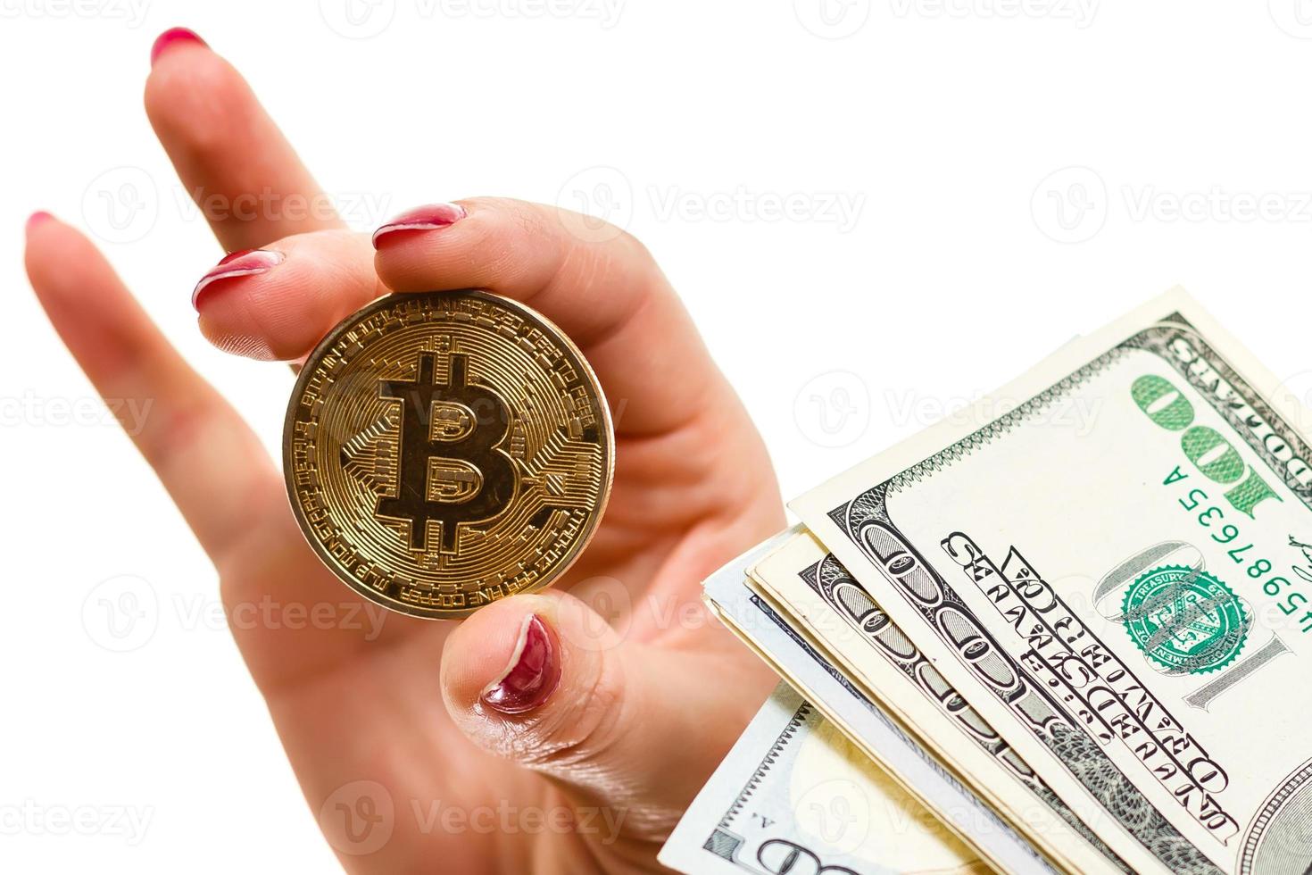 golden bitcoin on us dollars in a man hand digitall symbol of a new virtual currency photo