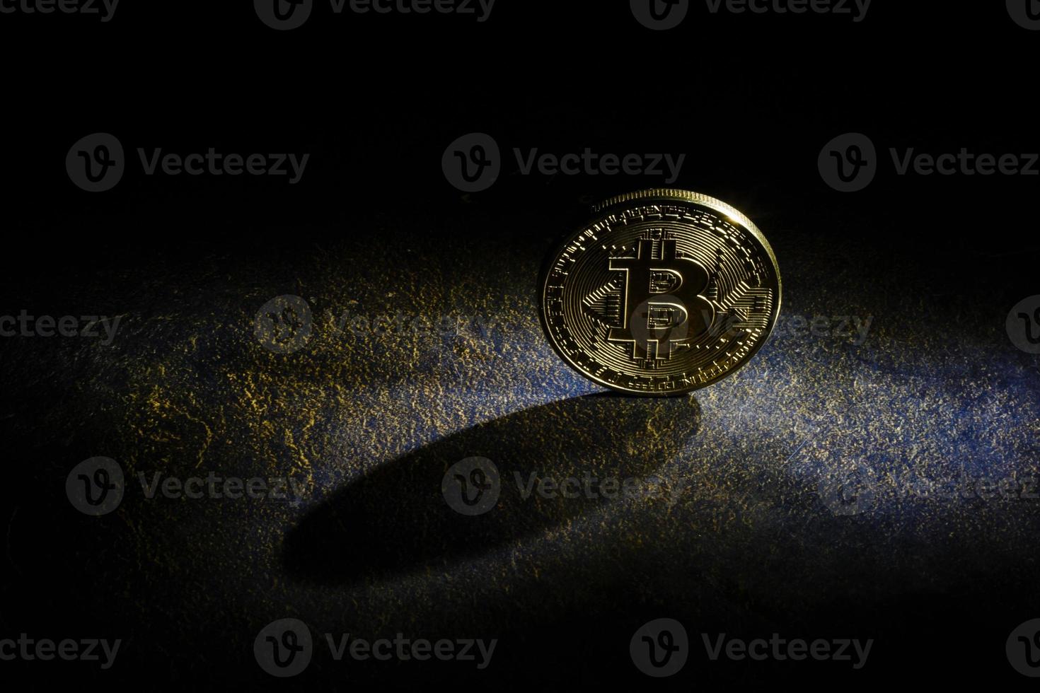 Golden bitcoins with the spotlight photo