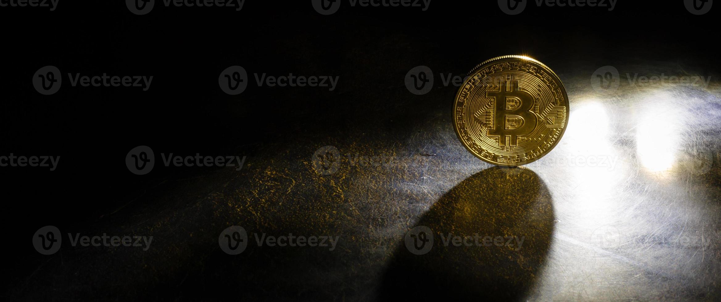 Golden bitcoins with the spotlight photo