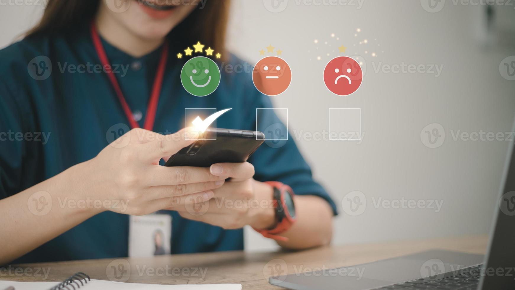 smart woman use smartphone choosing green happy smile face icon. feedback rating and positive customer review experience, satisfaction survey. mental health assessment. world mental health day concept photo