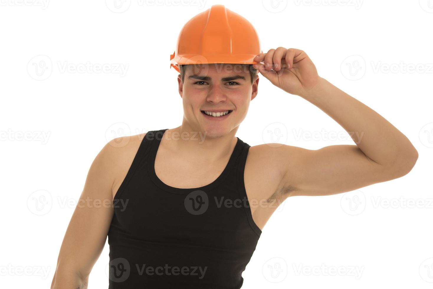 Portrait of happy young foreman with hard hat photo