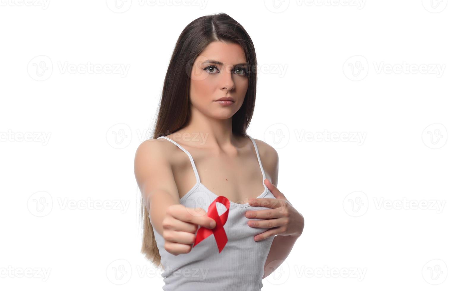Woman holding red ribbon for December world aids day. Healthcare concept photo