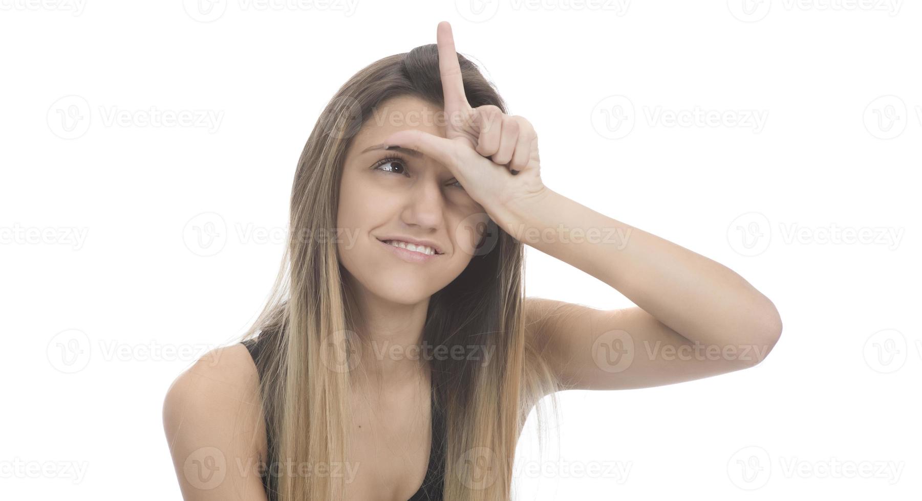 funny female model over white background crosses eyes and makes fish lips funny grimace photo