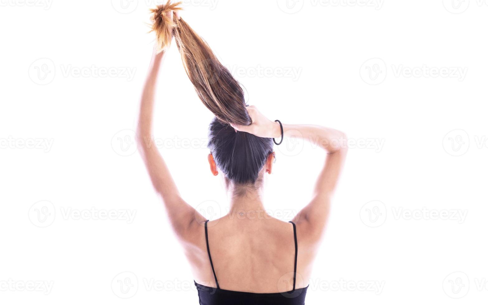 emale holding messy damaged dry hair in hands. photo