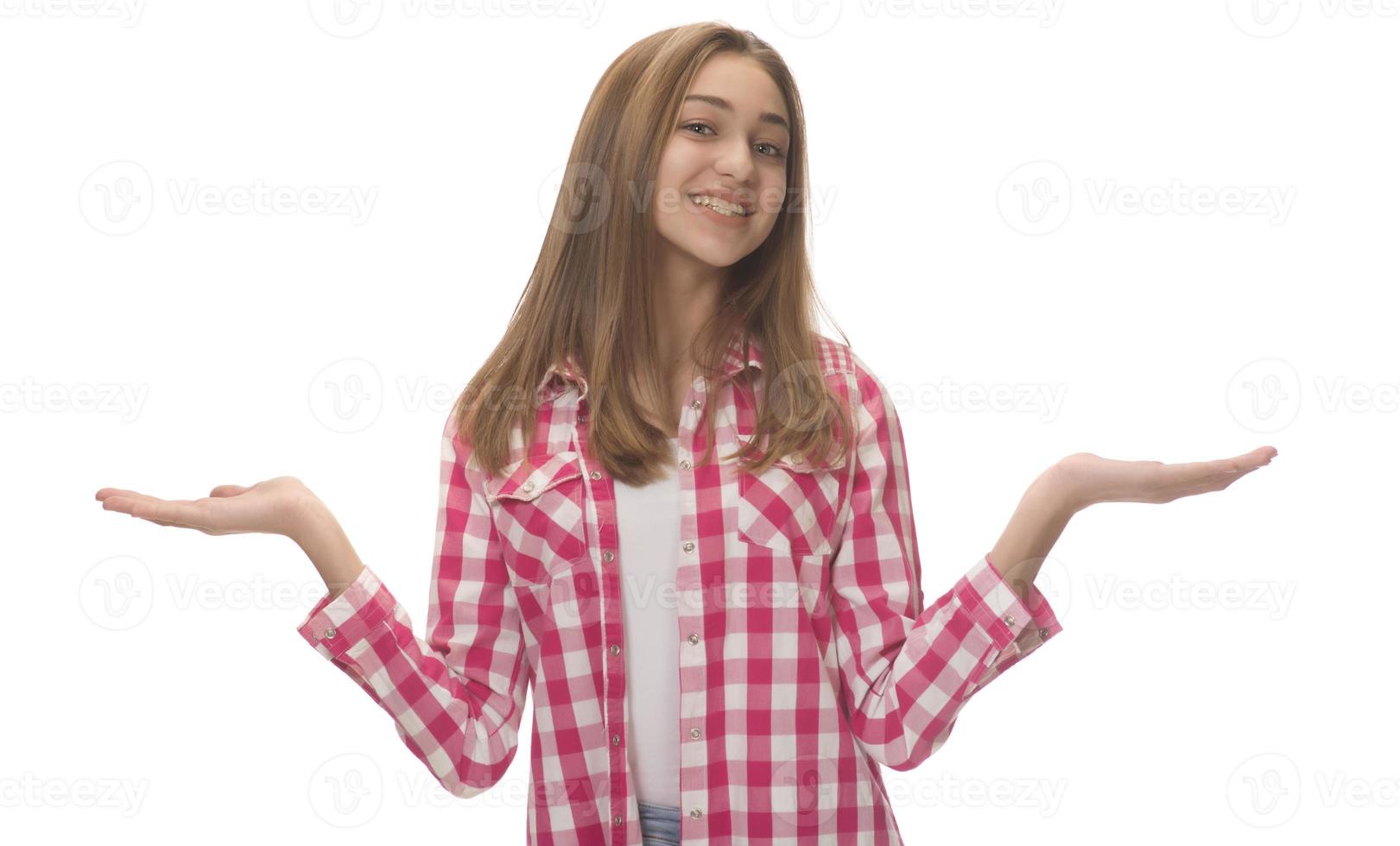 young beautiful woman in gray shirt , holding imaginary object on the palm. isolated on white photo