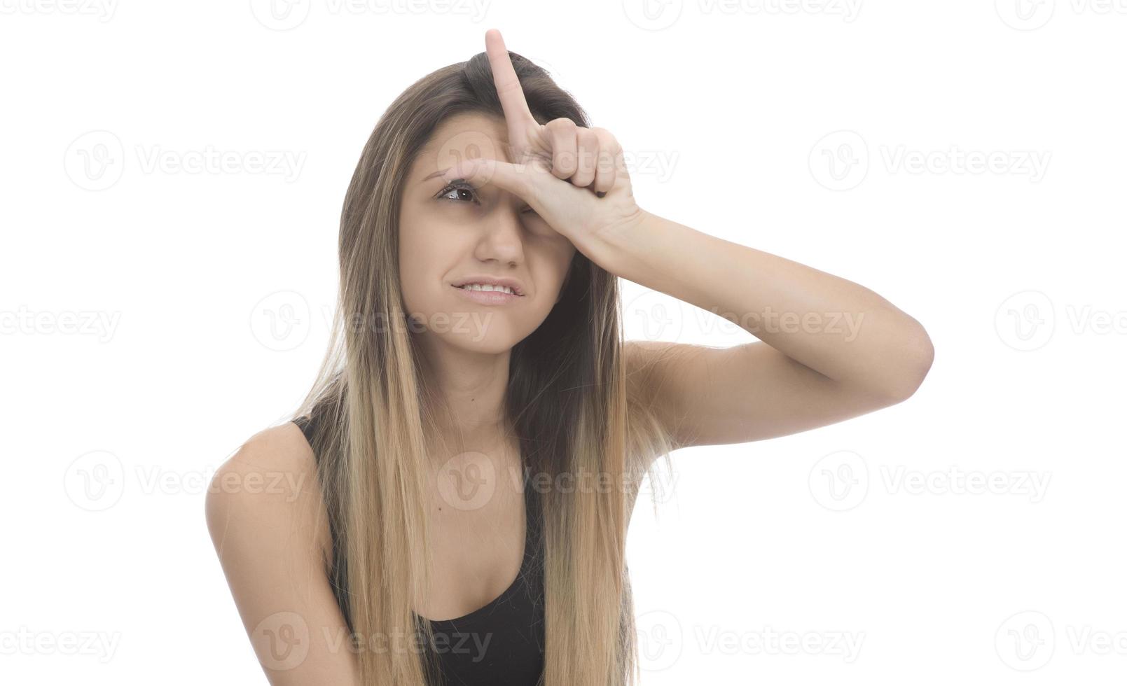 funny female model over white background crosses eyes and makes fish lips funny grimace photo