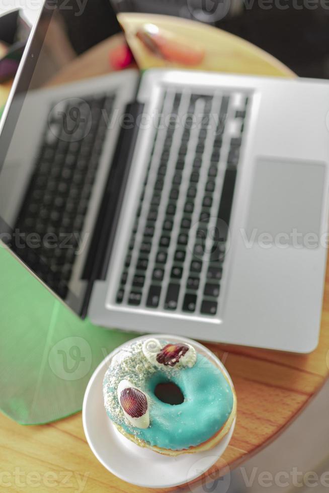 Comfortable workplace with mock up laptop computer, coffee cup photo