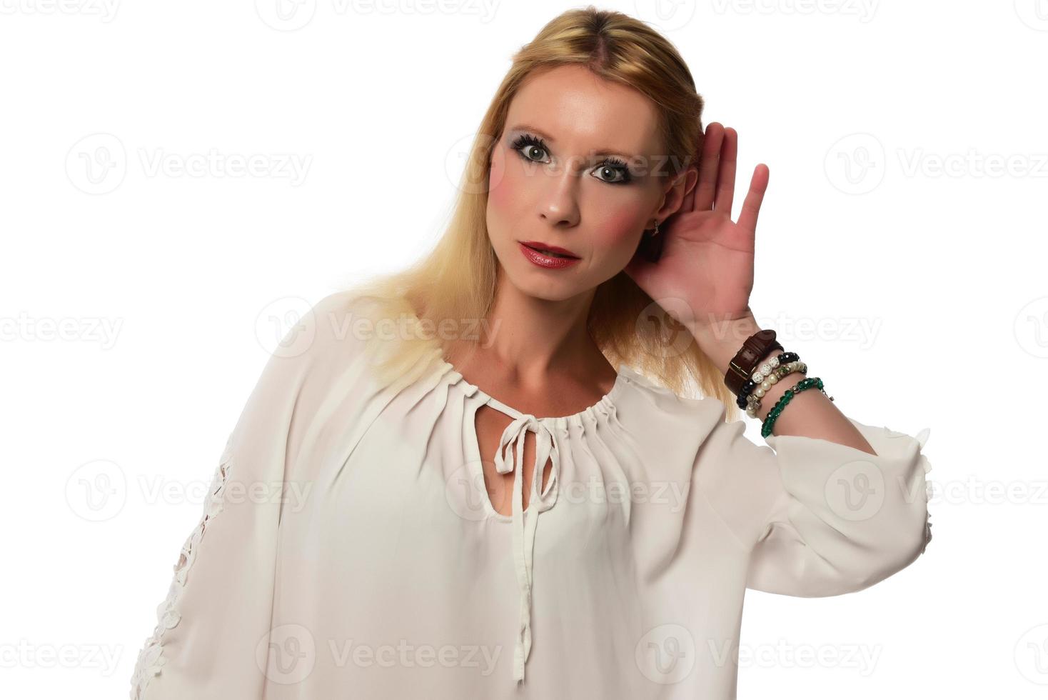 Female making can't hear you gesture isolated on white background photo