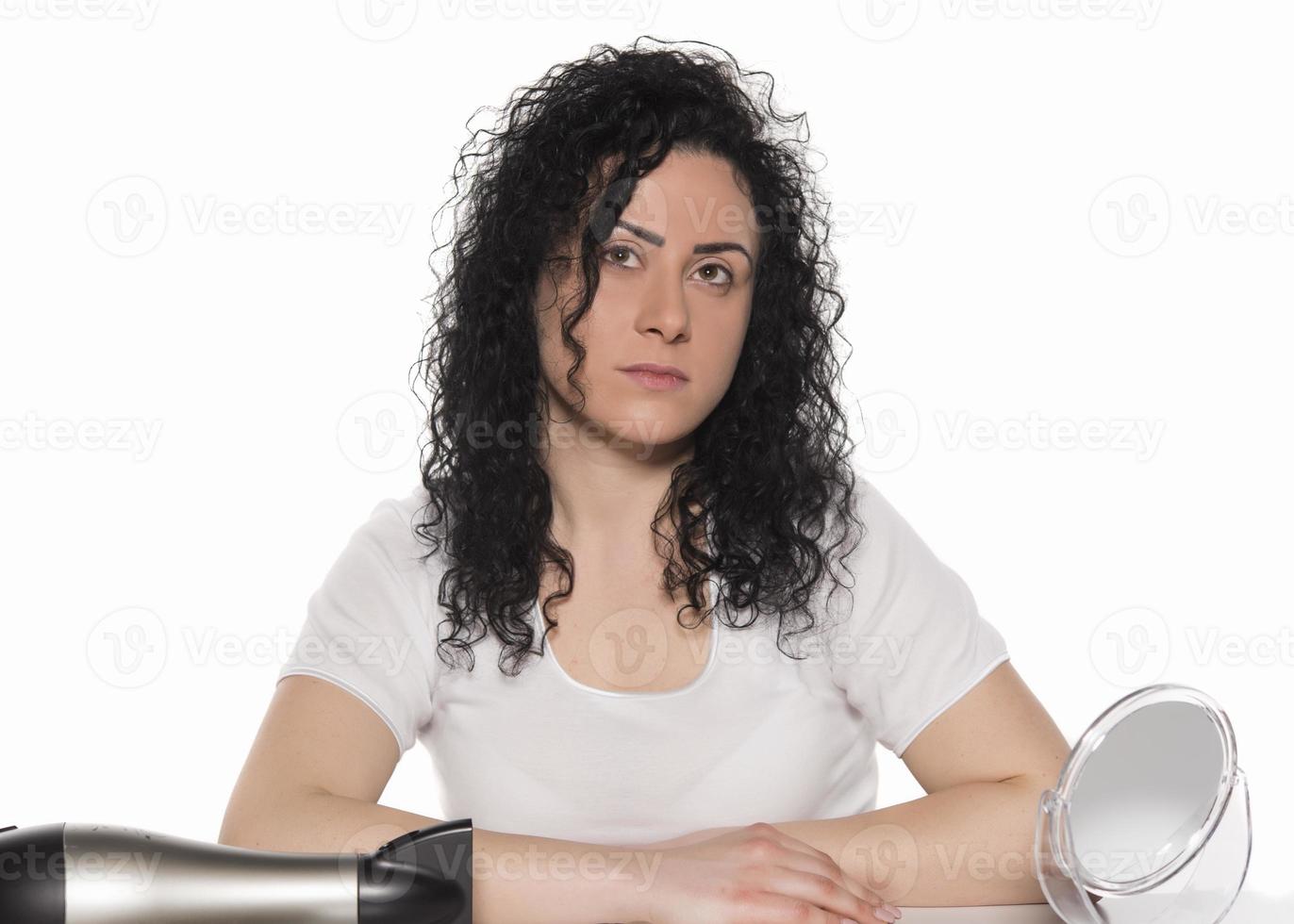 hair problems. young woman checking her damaged, and split hairs photo