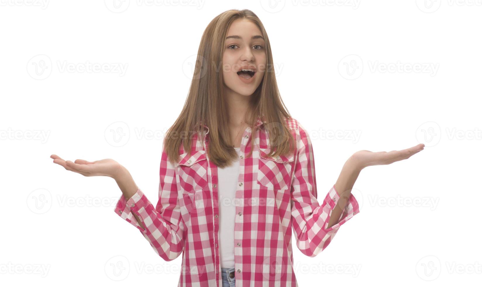 young beautiful woman in gray shirt , holding imaginary object on the palm. isolated on white photo
