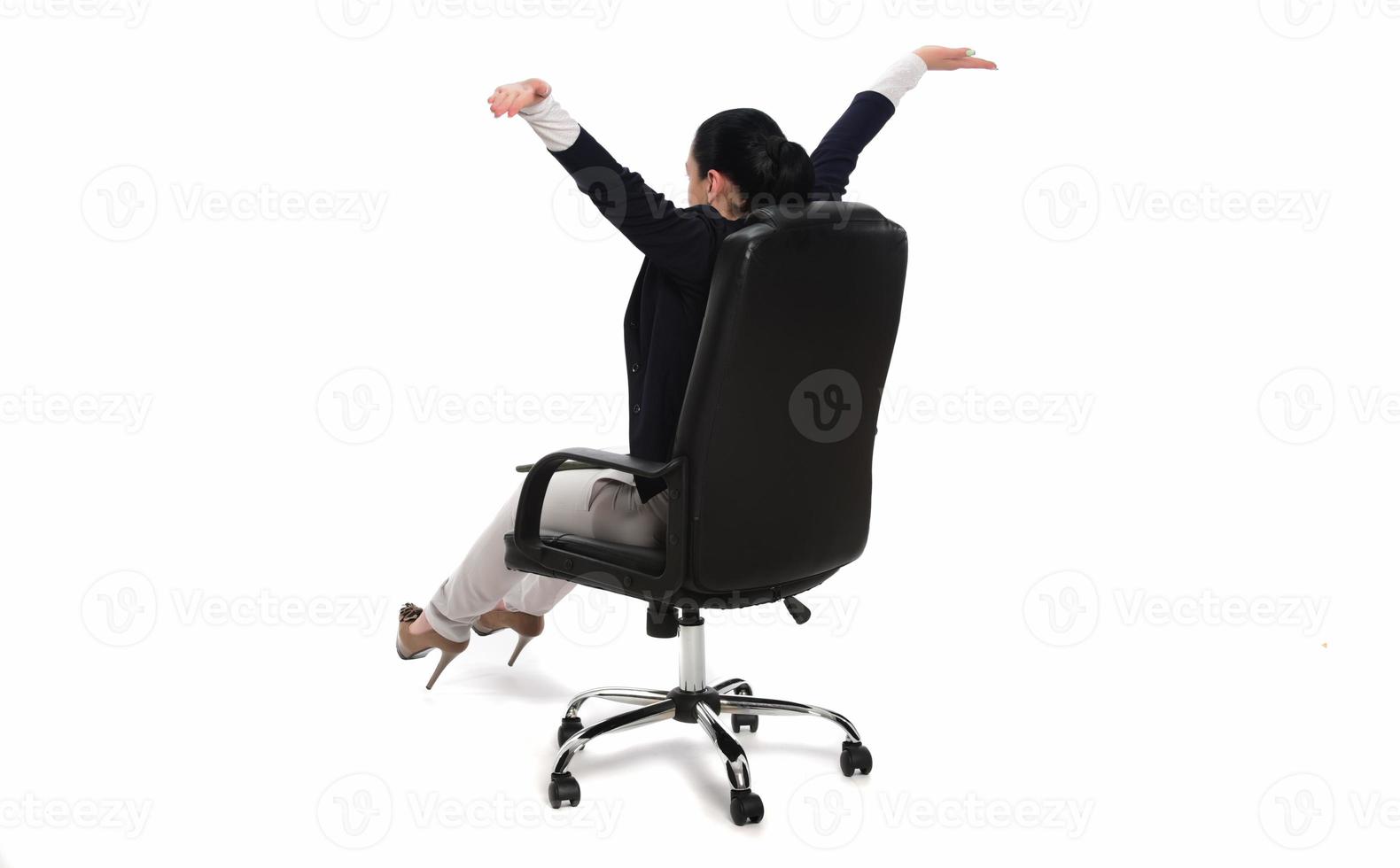 Young businesswoman sitting in comfortable office chair on white background photo