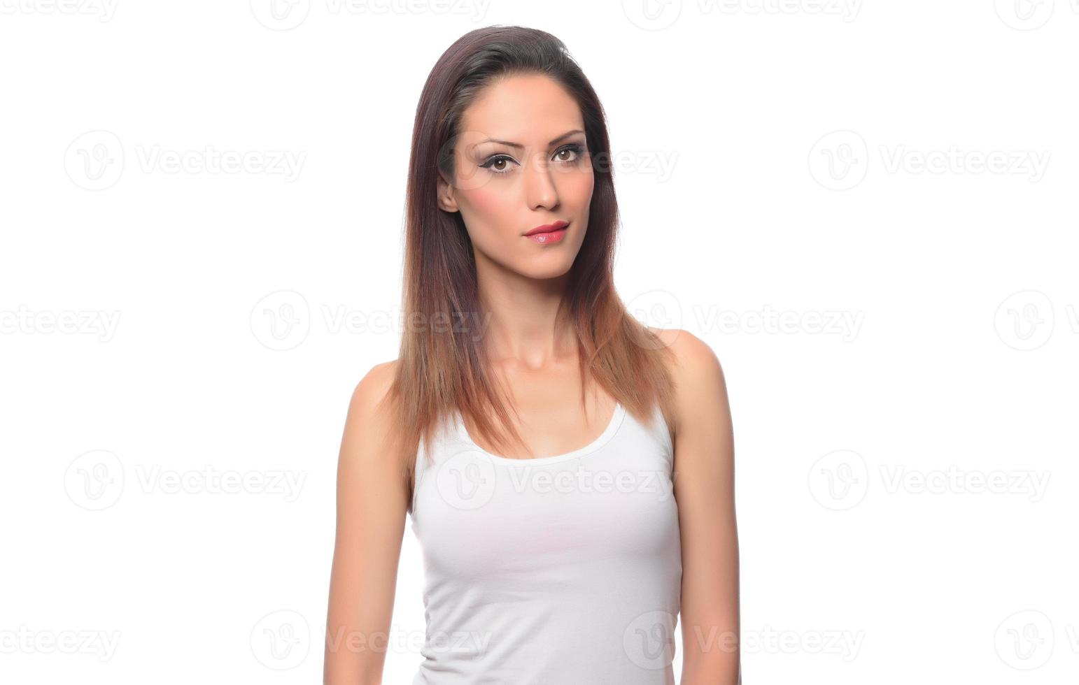 funny beautiful Arabic female model  wearing white sport set over white background crosses eyes and makes fish lips funny grimace posing on white background photo