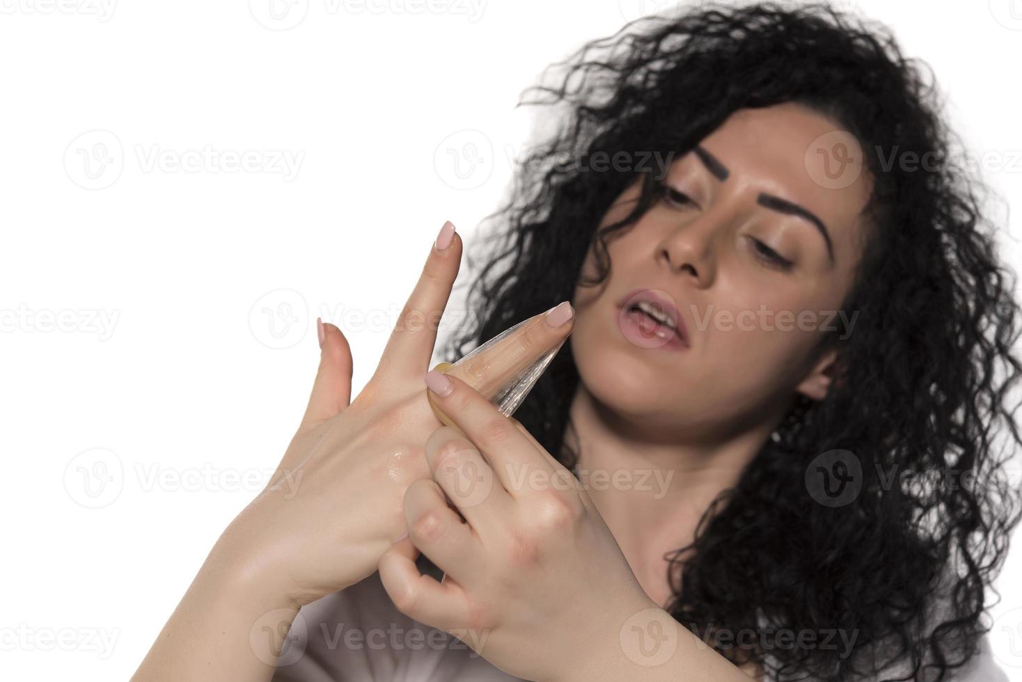 Condom in the hands of women photo