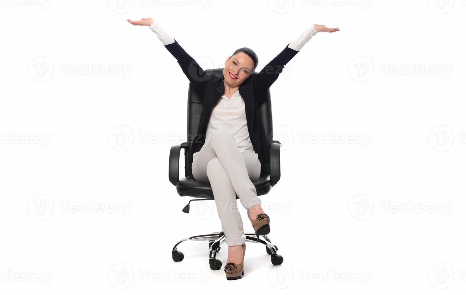 Young businesswoman sitting in comfortable office chair on white background photo