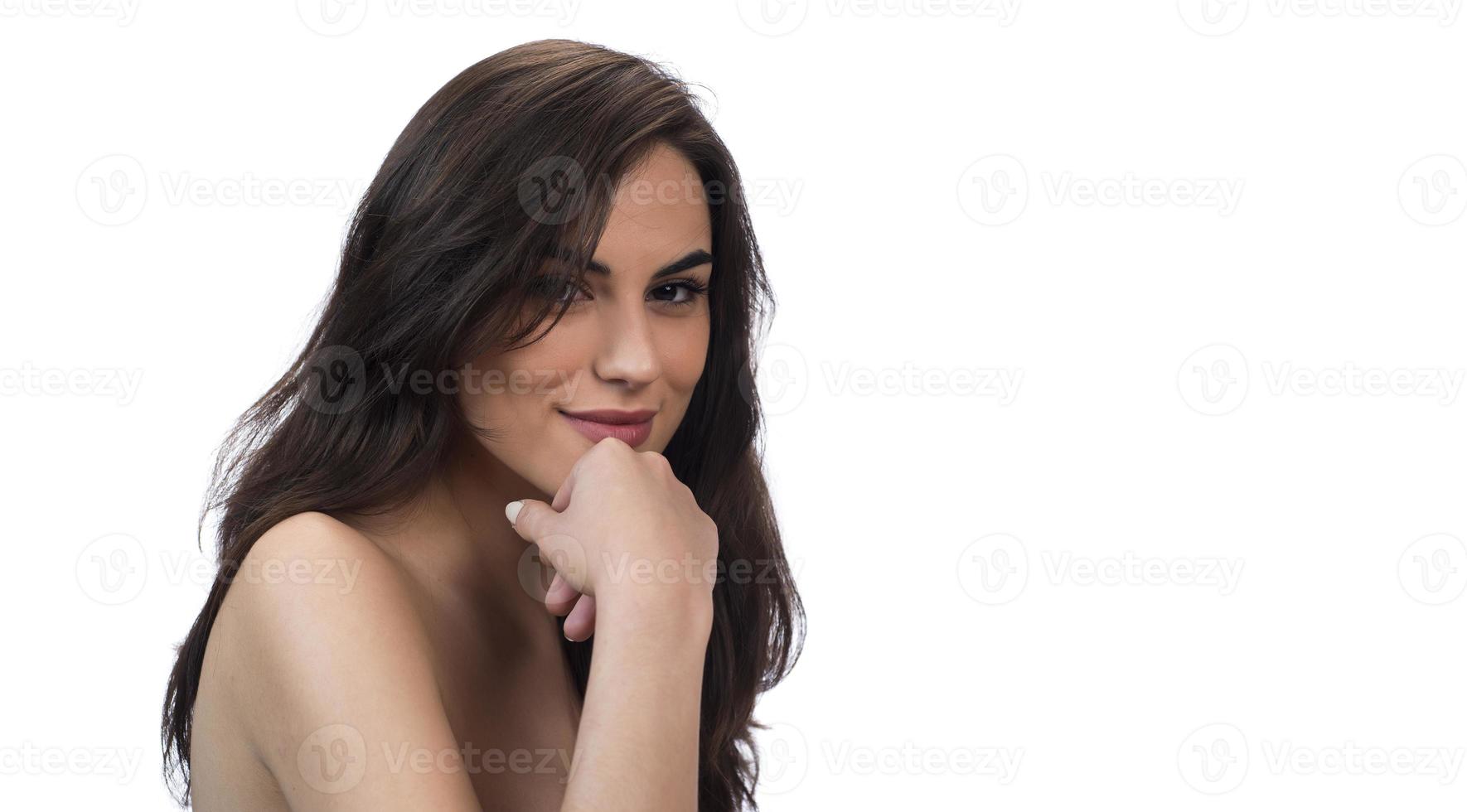 Portrait of attractive woman on white wall background photo