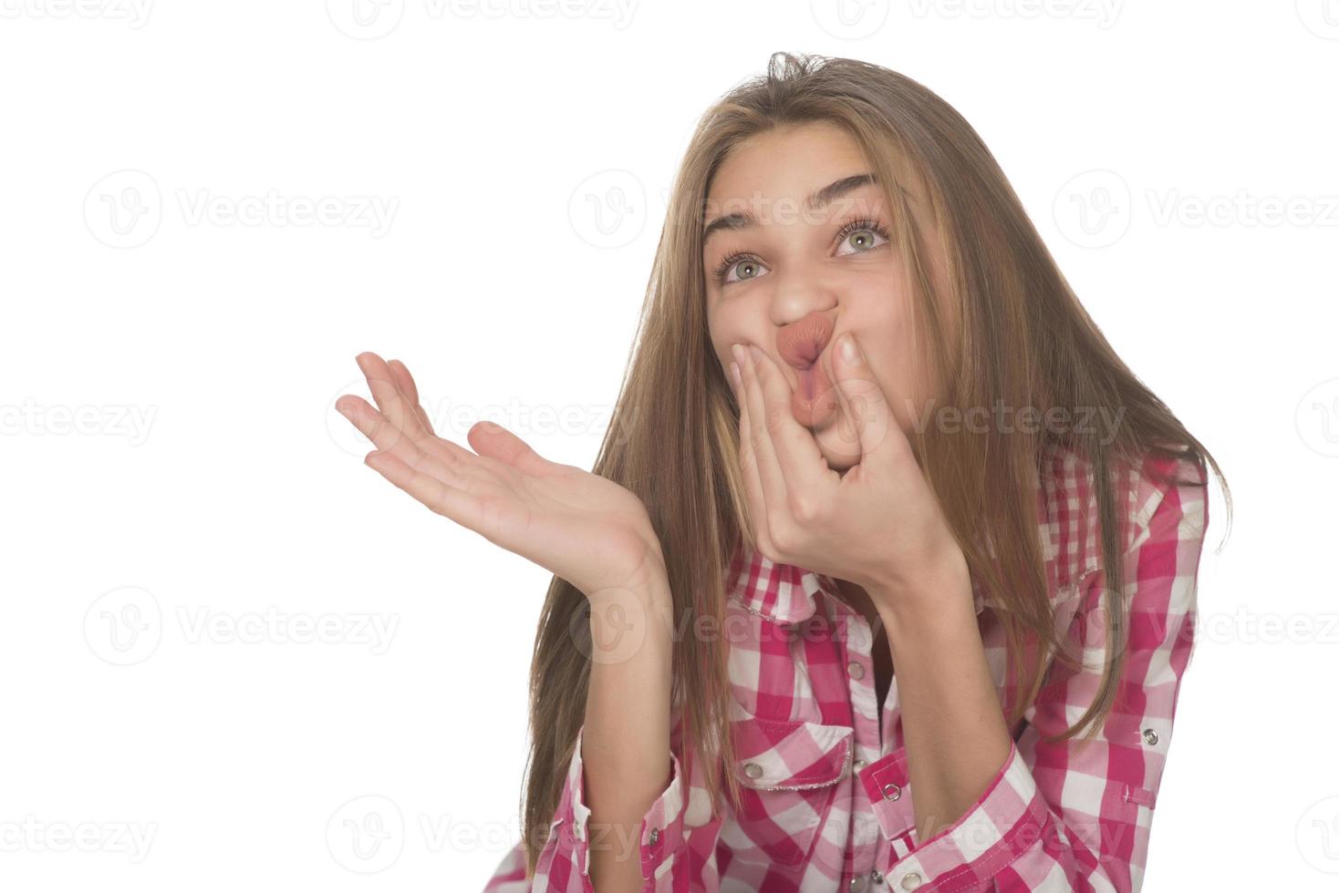 young woman looking amazed posing isolated on white background photo