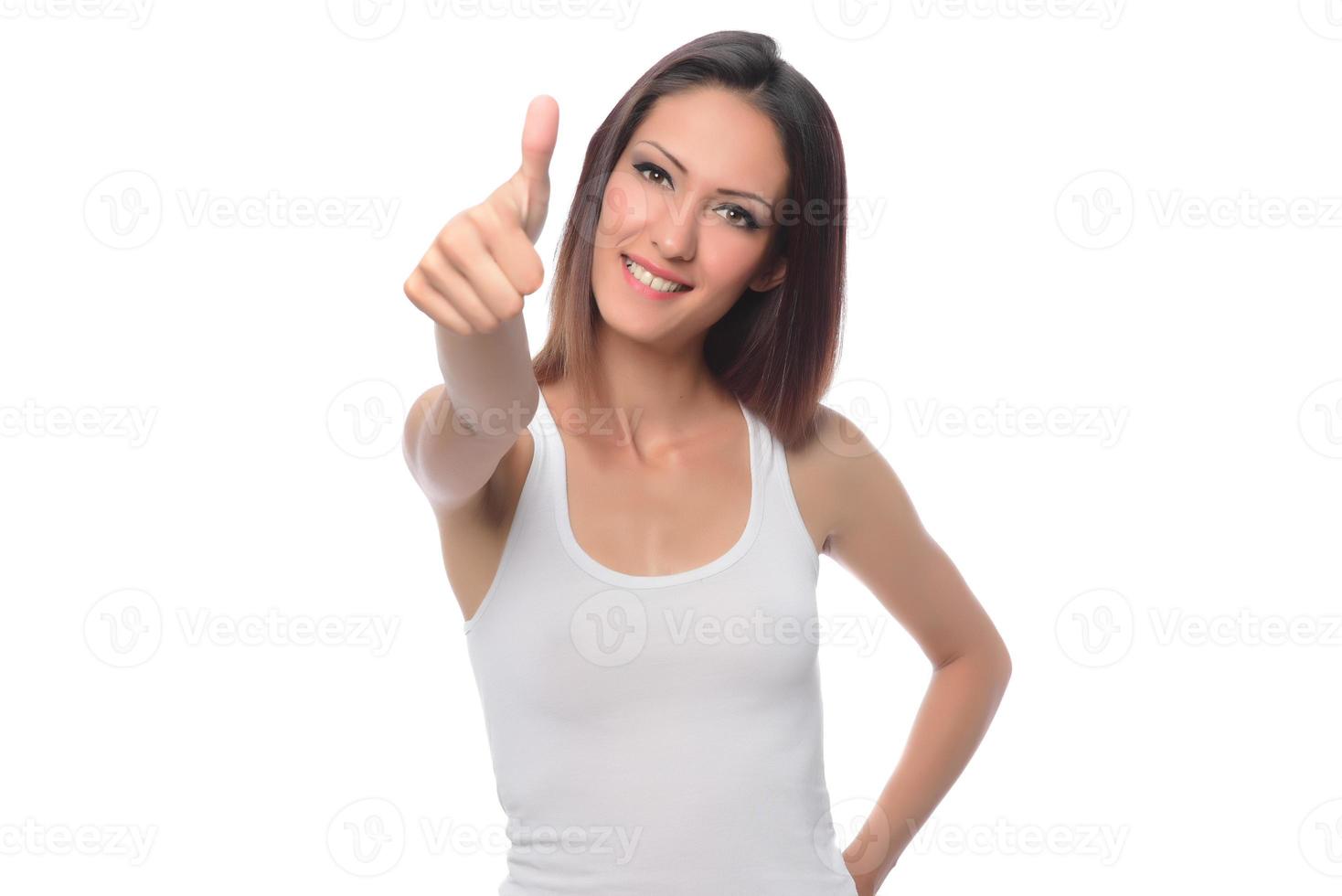 funny beautiful Arabic female model  wearing white sport set over white background crosses eyes and makes fish lips funny grimace posing on white background photo