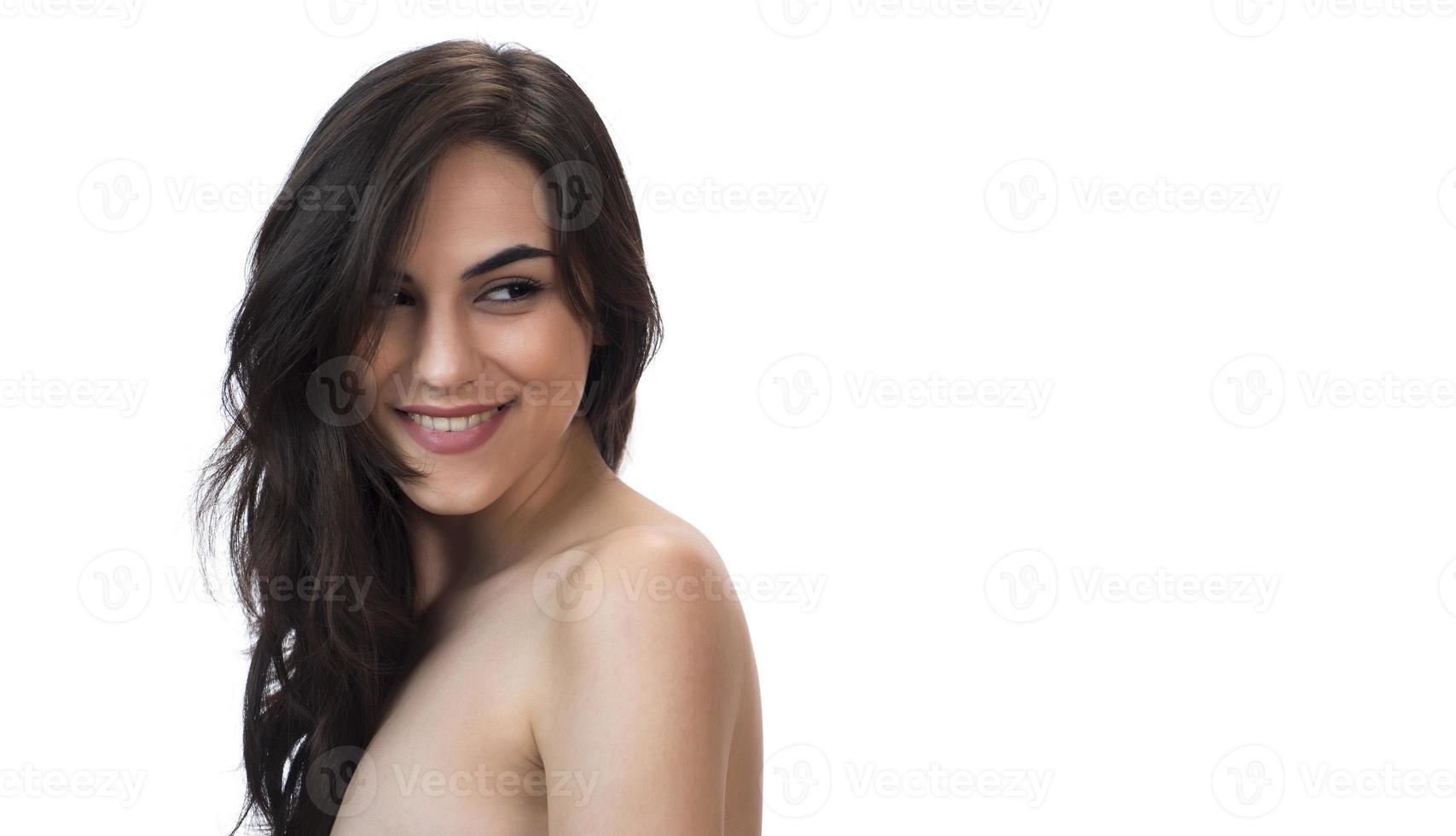Portrait of attractive woman on white wall background photo