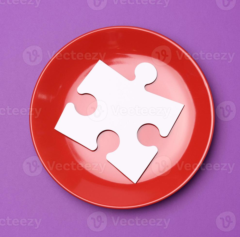 red round ceramic plates on a purple background photo
