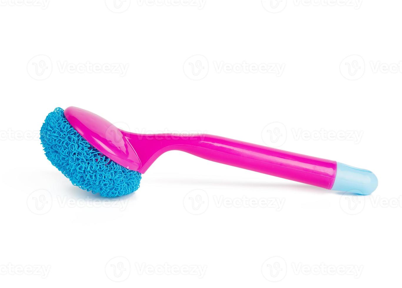 pink plastic brush for cleaning the house isolated on a white background photo