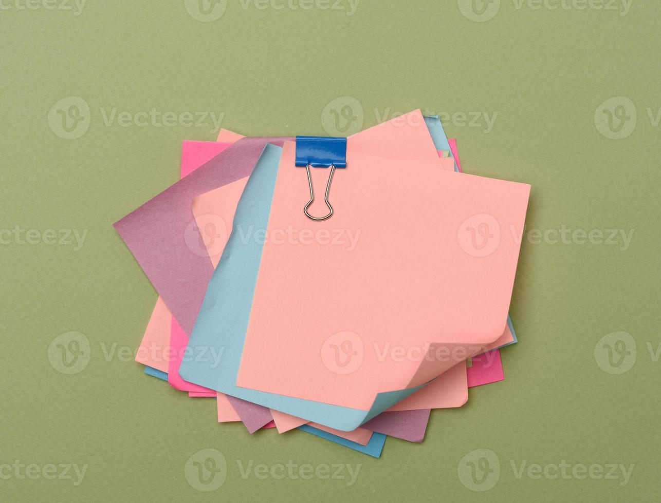 stack of colorful stickers on green background photo