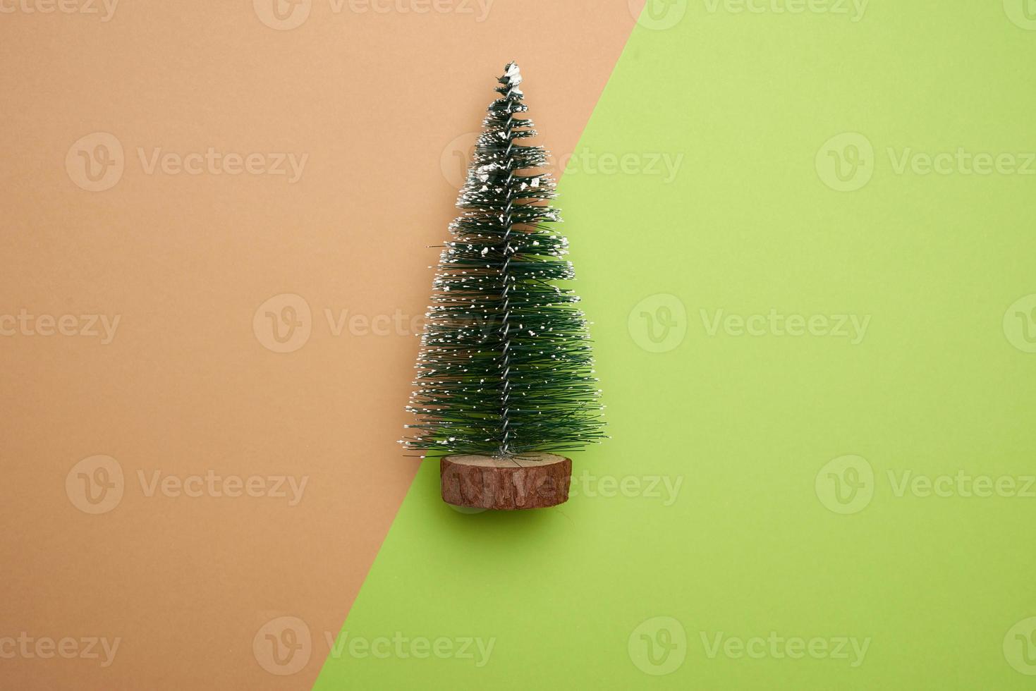 christmas decor green tree on colored surface, minimalism photo