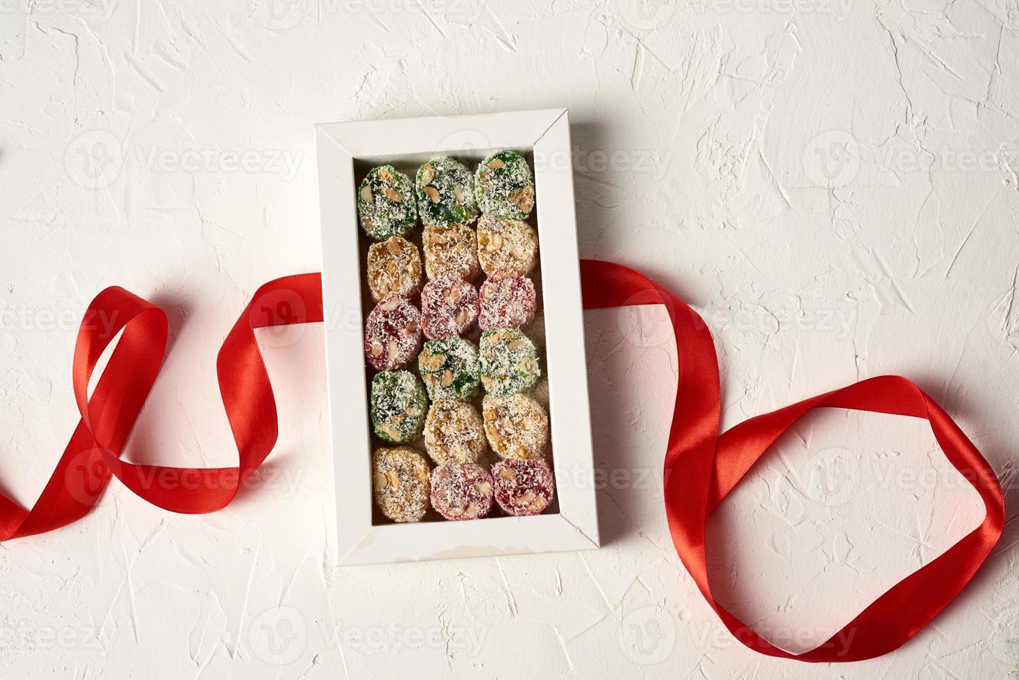 sweet Turkish delight in coconut white shavings, dessert lies in rows photo