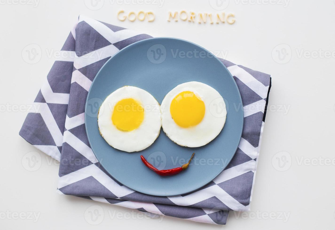 two beautiful eggs on a plate photo
