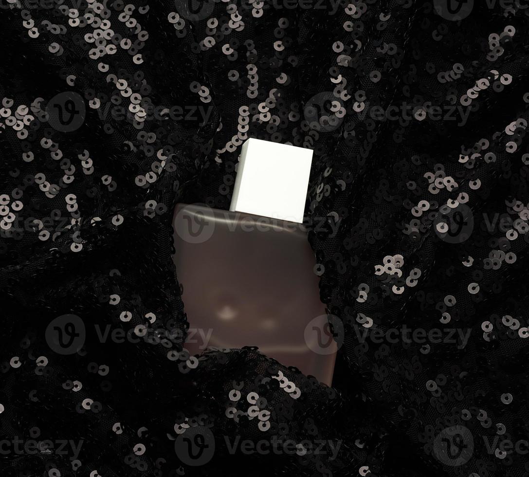 glass bottle with pink perfume liquid on black background with shiny sequins photo
