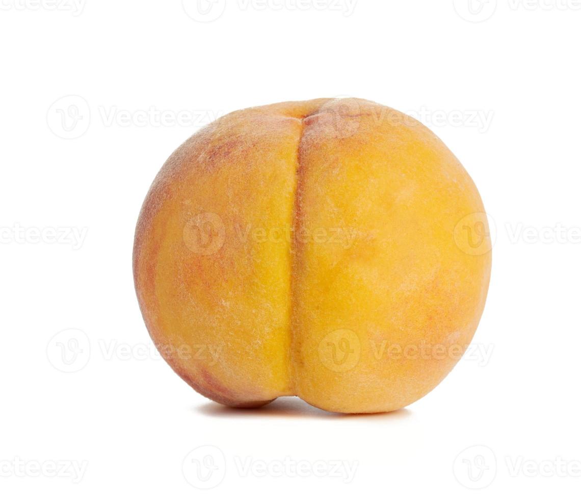 whole ripe yellow peach isolated on a white background photo