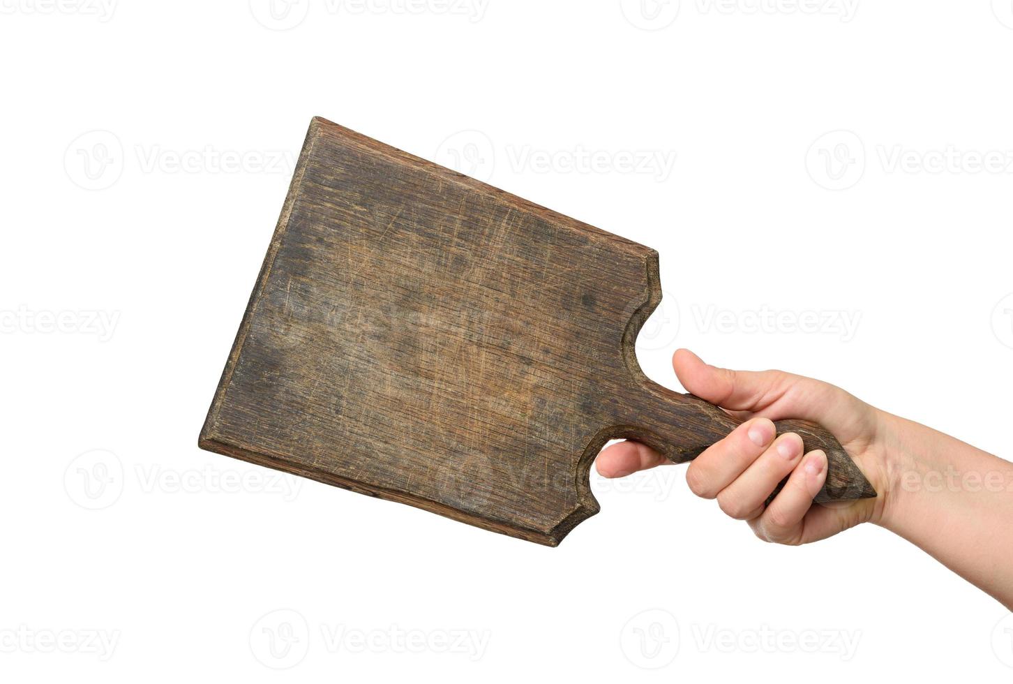 woman holding blank brown rectangular wooden board in hand photo