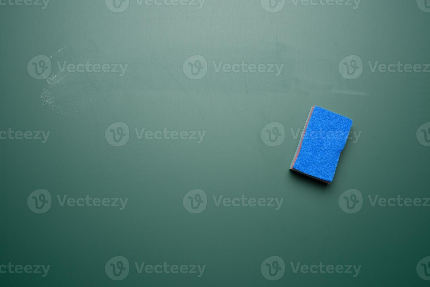 blue sponge for wiping chalk green board photo