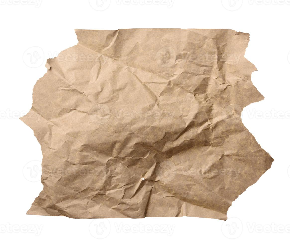 piece of crumpled brown paper isolated on white background, element for designer photo