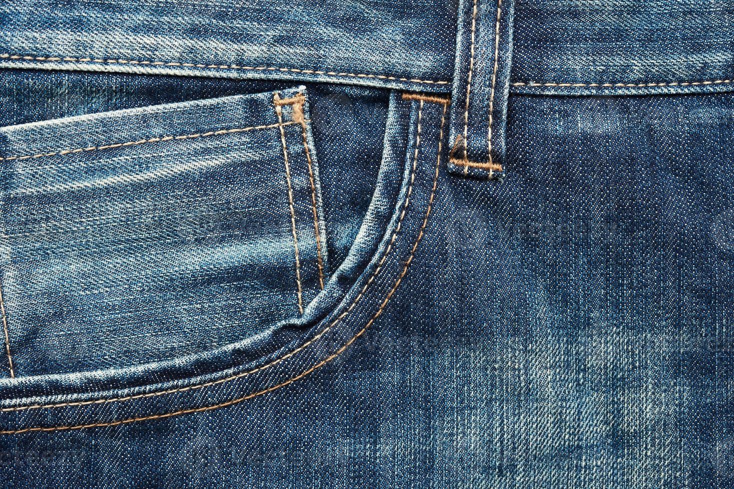 front pocket of blue classic jeans, full frame photo