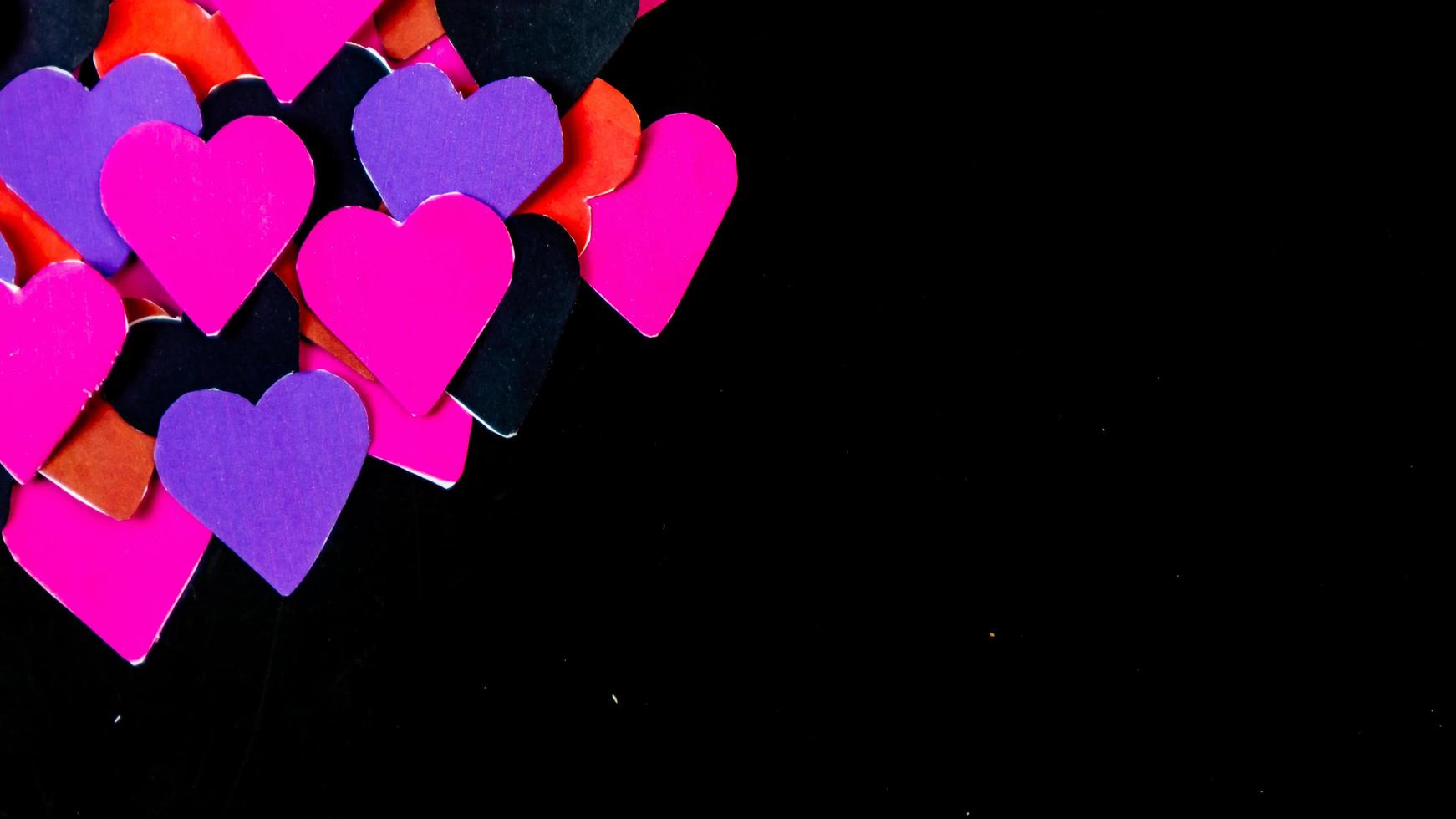 multicolored heart on black background for valentine's day photo
