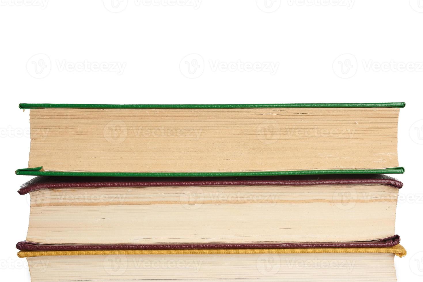 stack of various books, items are isolated on white background photo